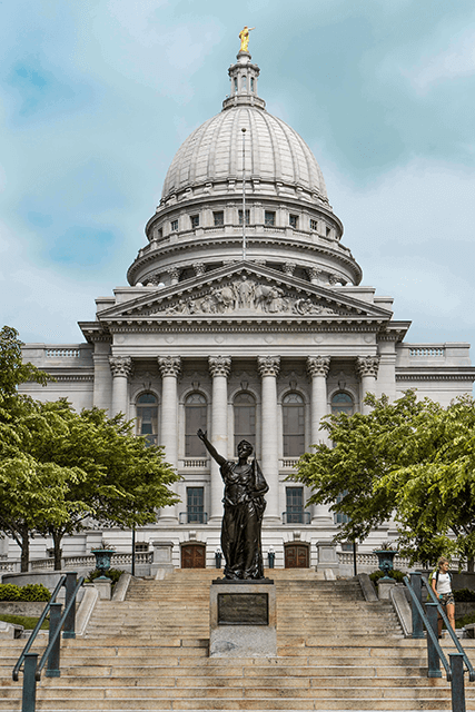 a group of icons showing scales of justice, a certified form, a government building and a gavel